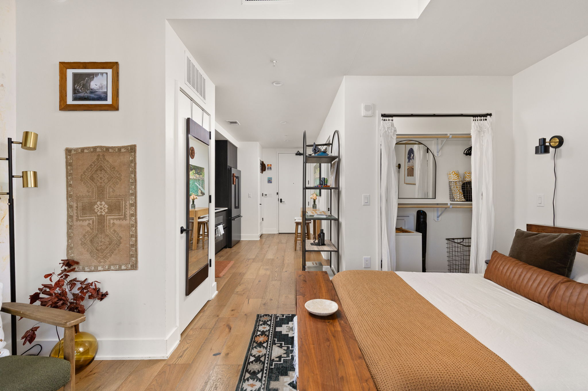 48 East Avenue, Unit 2002 Austin, TX 78701 - Photo 12 of 38 Bedroom featuring light wood-style flooring and a closet