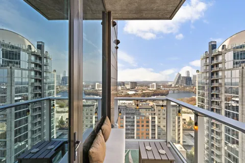 a view of a balcony with city view