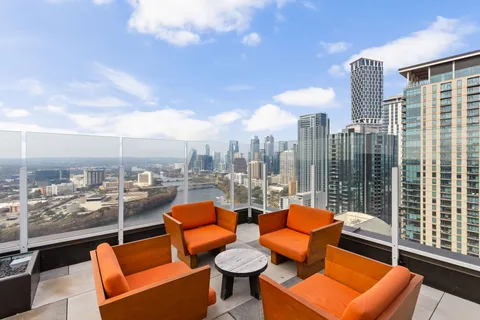 a blue couch sitting in front of a building