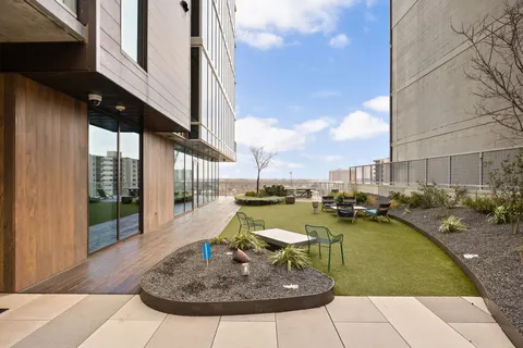 a view of a swimming pool with outdoor seating