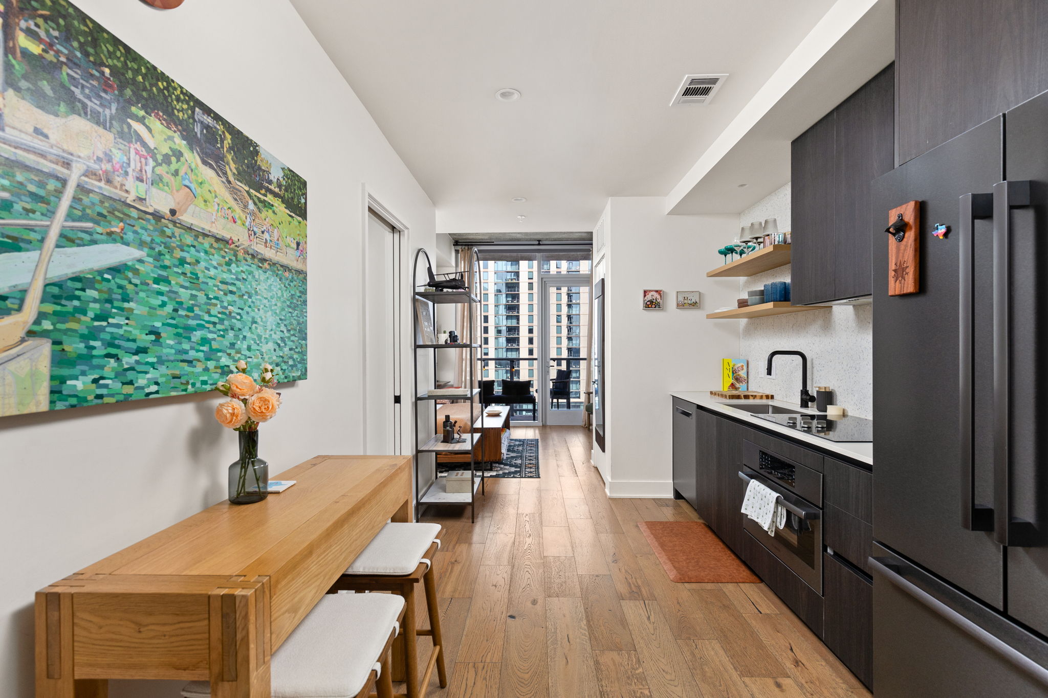 48 East Avenue, Unit 2002 Austin, TX 78701 - Photo 4 of 38 Hall featuring light wood-type flooring and a sink