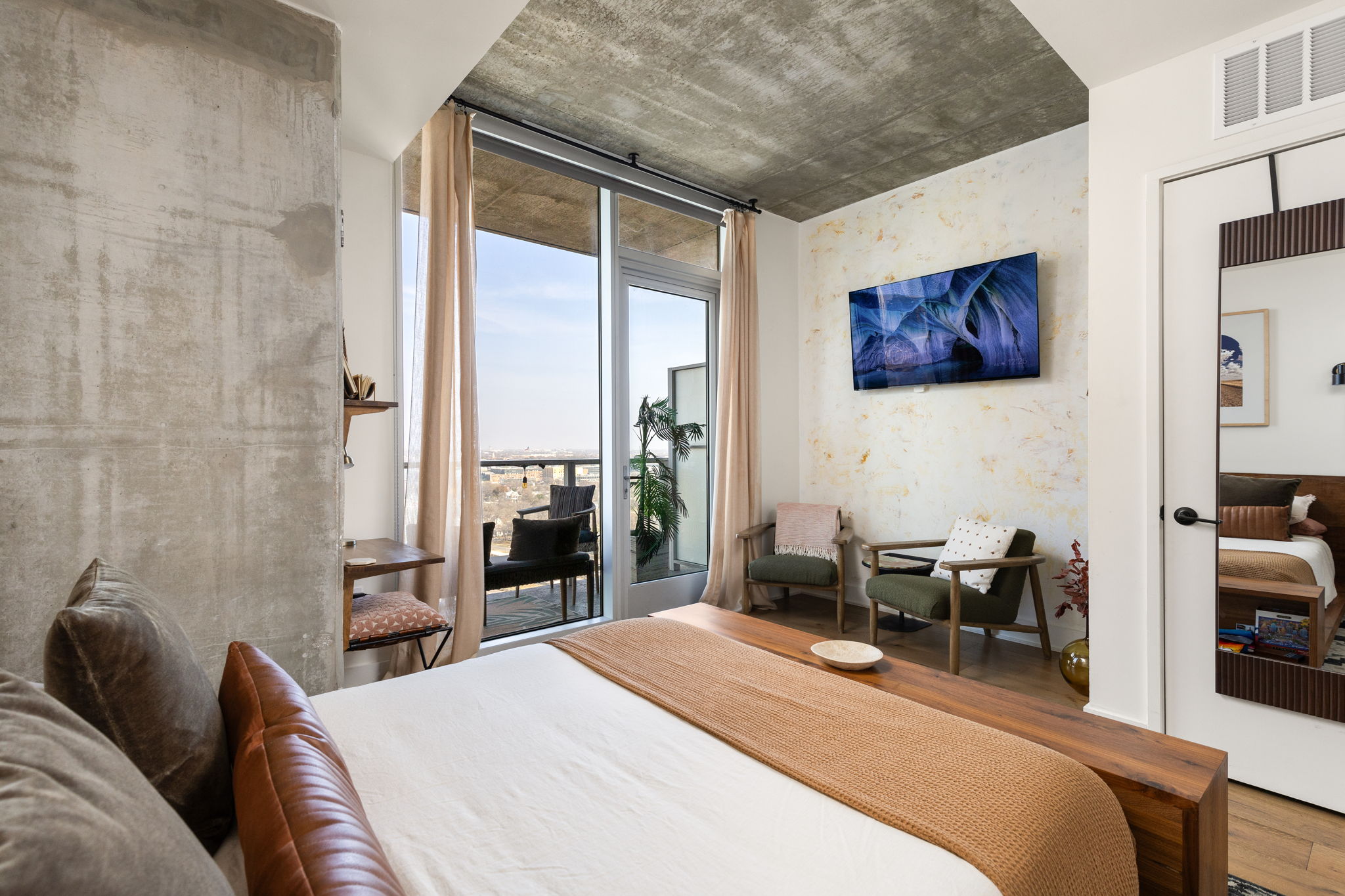 48 East Avenue, Unit 2002 Austin, TX 78701 - Photo 9 of 38 Bedroom featuring floor to ceiling windows, wood finished floors, and access to outside