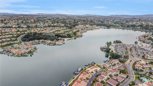 an aerial view of a house with a lake view