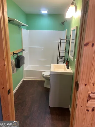 a bed room with furniture and gym equipment