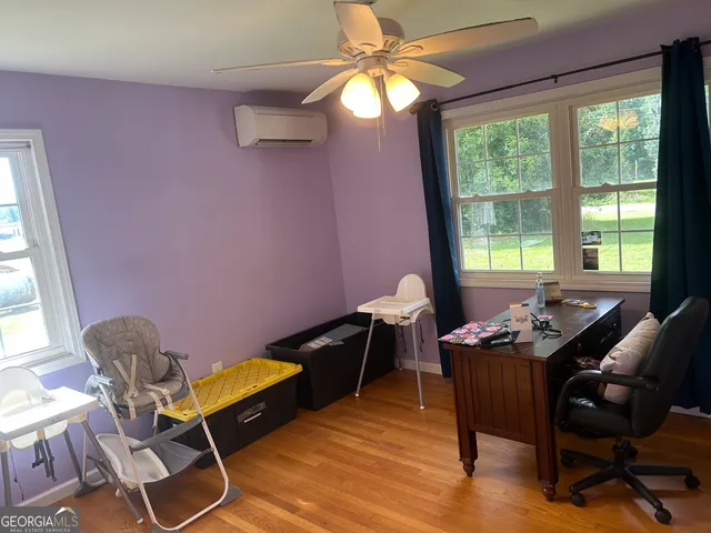 a room with furniture and a flat screen tv