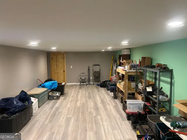 a view of a refrigerator in kitchen and wooden floor