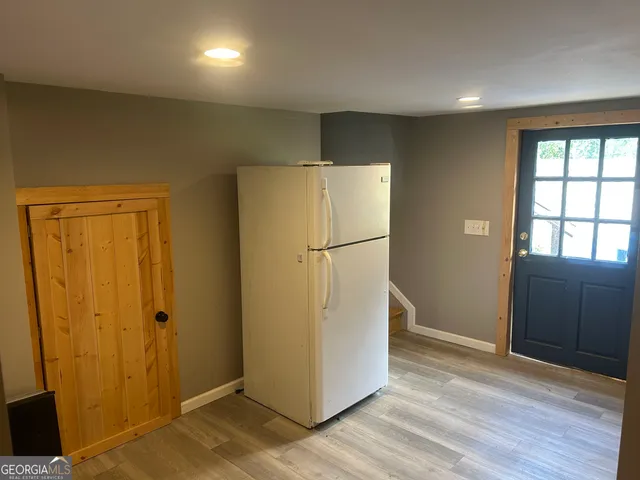 a bedroom with furniture and window