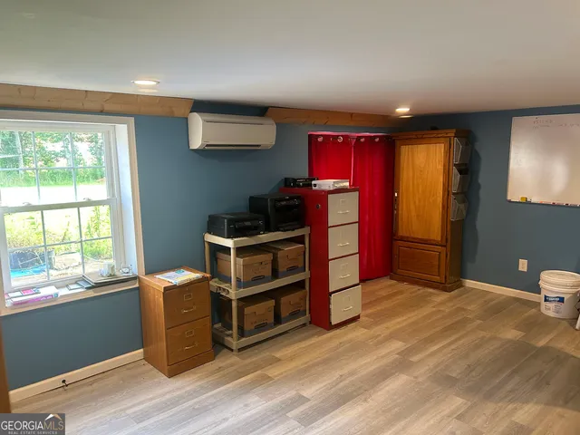 a view of a playground with basketball court