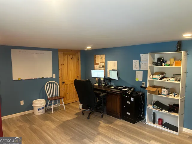 a view of a garden with a building in the background