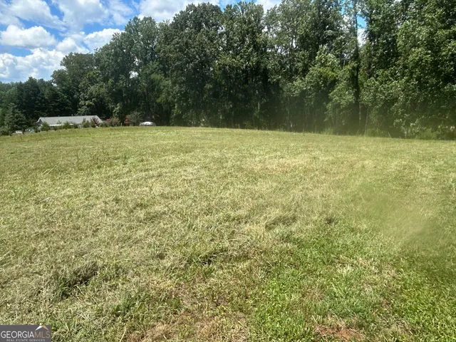 a view of a golf course with a swimming pool