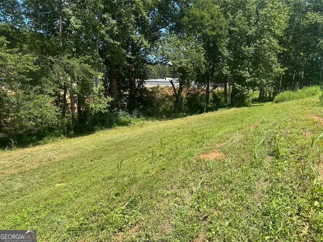 a view of a lake with a big yard