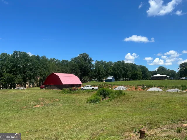 a kitchen with stainless steel appliances granite countertop white cabinets granite counter tops and a window
