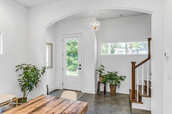 a view of a room with window and flower pot