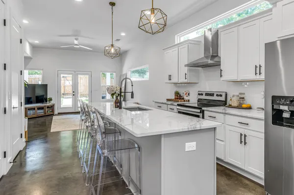 a kitchen with a counter space cabinets and appliances