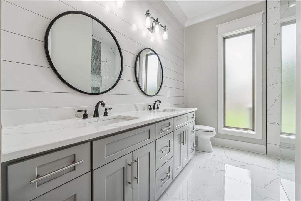 852 Tom Miller Road Bethlehem, GA 30620 - Photo 35 of 68 a bathroom with a granite countertop sink mirror and toilet
