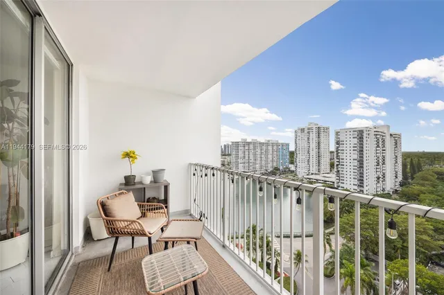 a view of roof deck with chair and wooden fence