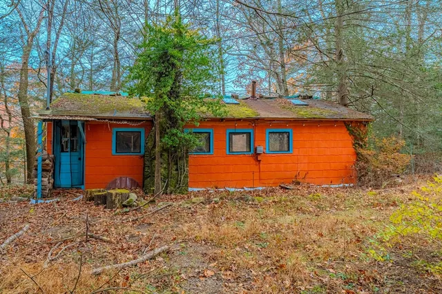 a front view of a house with yard