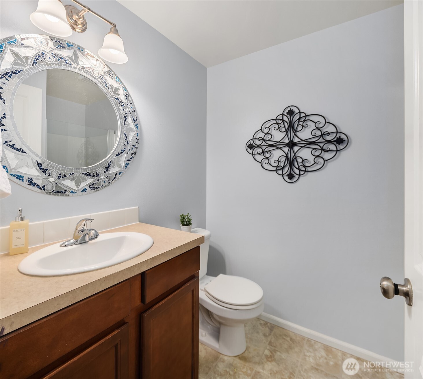 4119 167th Place Southeast Bothell, WA 98012 - Photo 14 of 39 a bathroom with a toilet sink and mirror