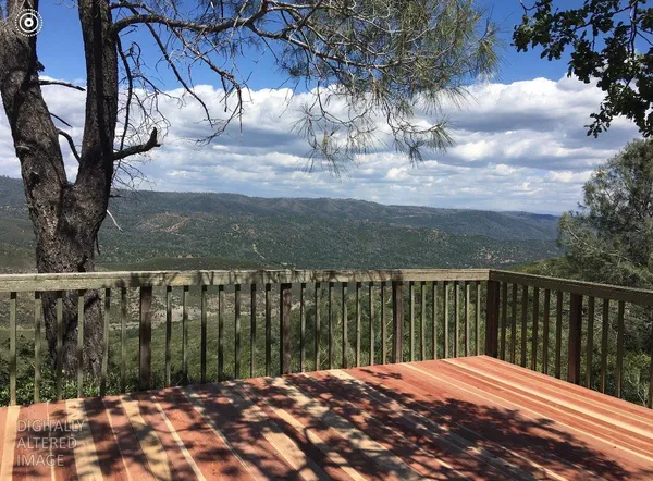 a view of balcony with wooden floor