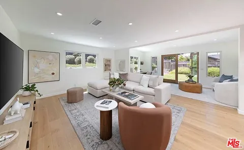 a living room with furniture and window