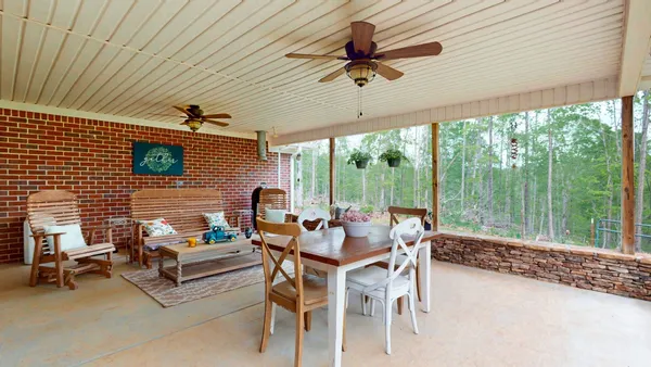 a outdoor space with patio the couches and a dining table with garden view