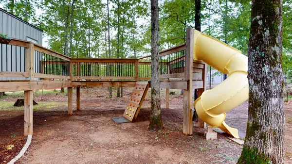 a view of a house with backyard