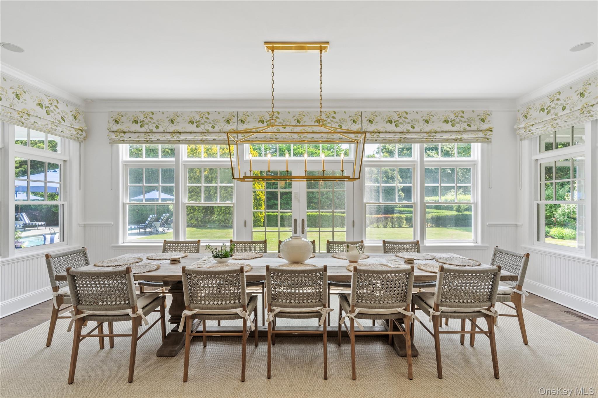 327 Georgica Road East Hampton, NY 11937 - Photo 11 of 36 a dining room with furniture and a large window