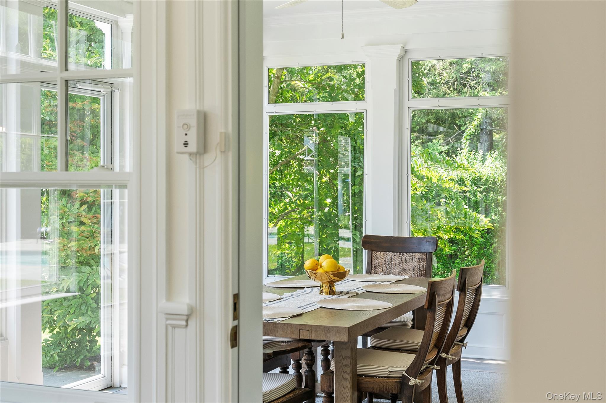 327 Georgica Road East Hampton, NY 11937 - Photo 12 of 36 a view of a dining room with furniture window and outside view