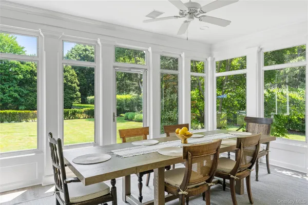 a view of a dining room with furniture window and outside view