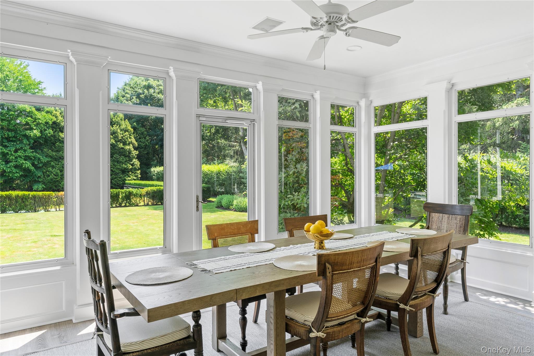327 Georgica Road East Hampton, NY 11937 - Photo 13 of 36 a view of a dining room with furniture window and outside view
