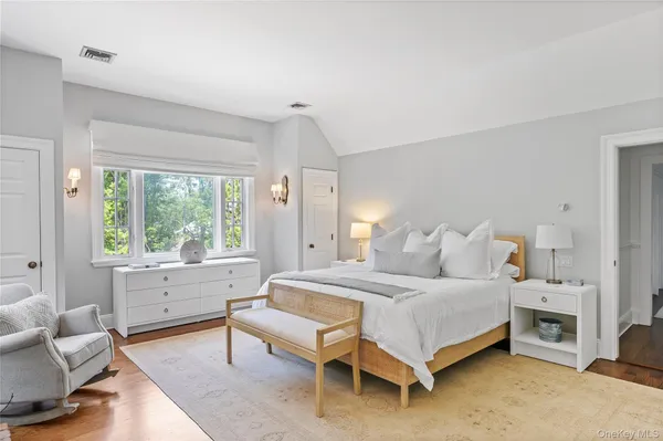 a bedroom with a bed and a couch