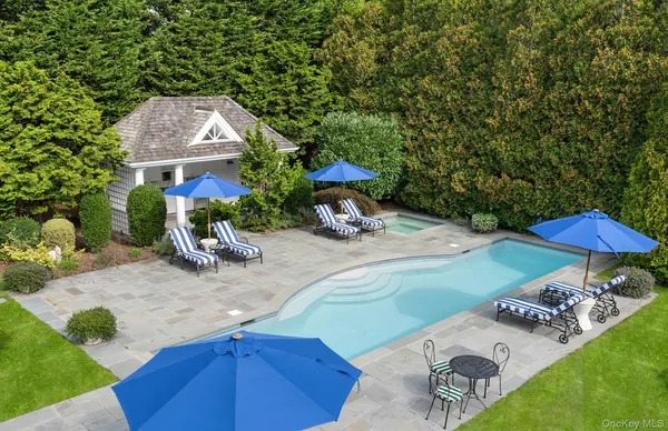 an outdoor space with furniture and umbrella