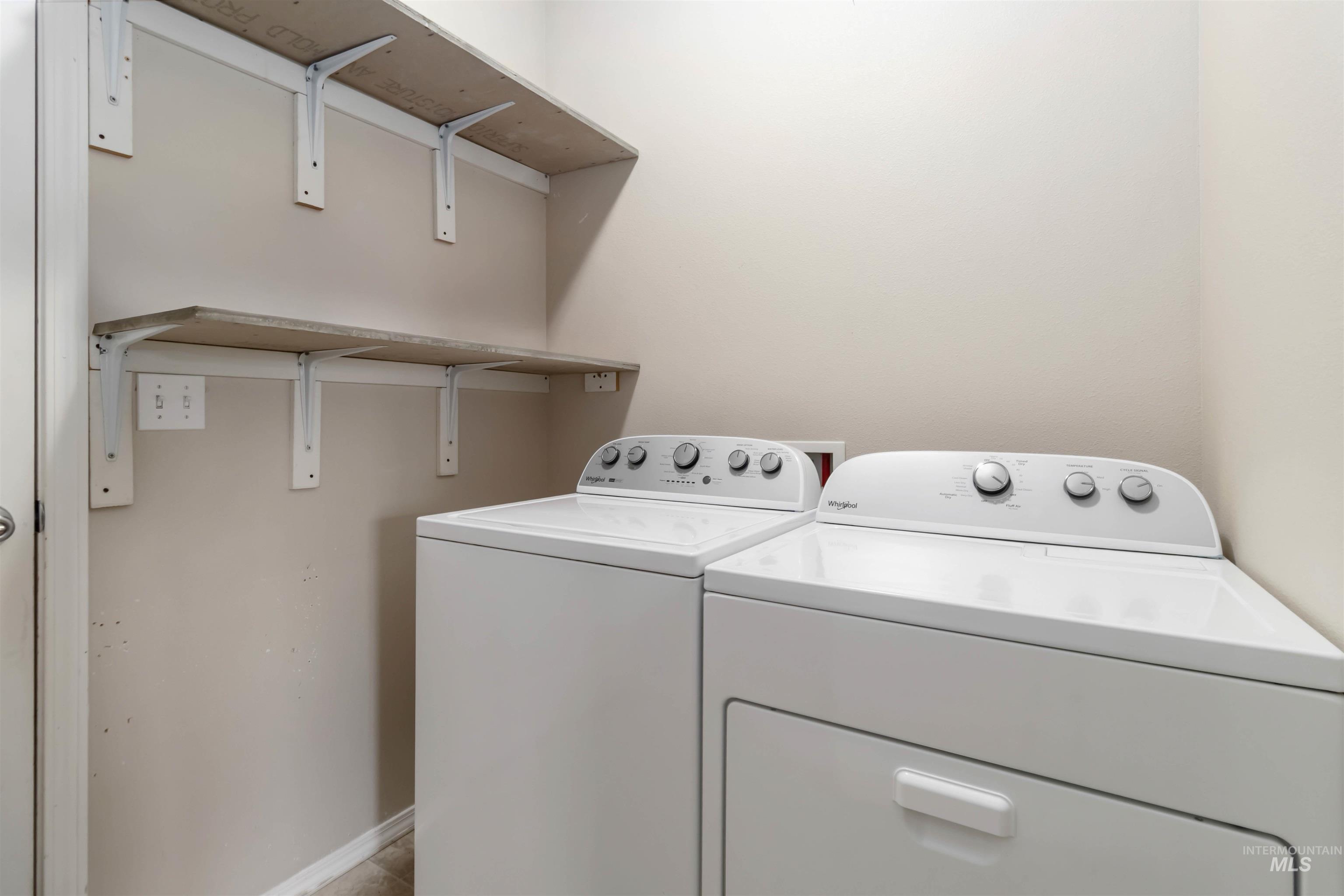 16053 Sunnyfield Avenue Caldwell, ID 83607 - Photo 14 of 35 Laundry area with separate washer and dryer and baseboards