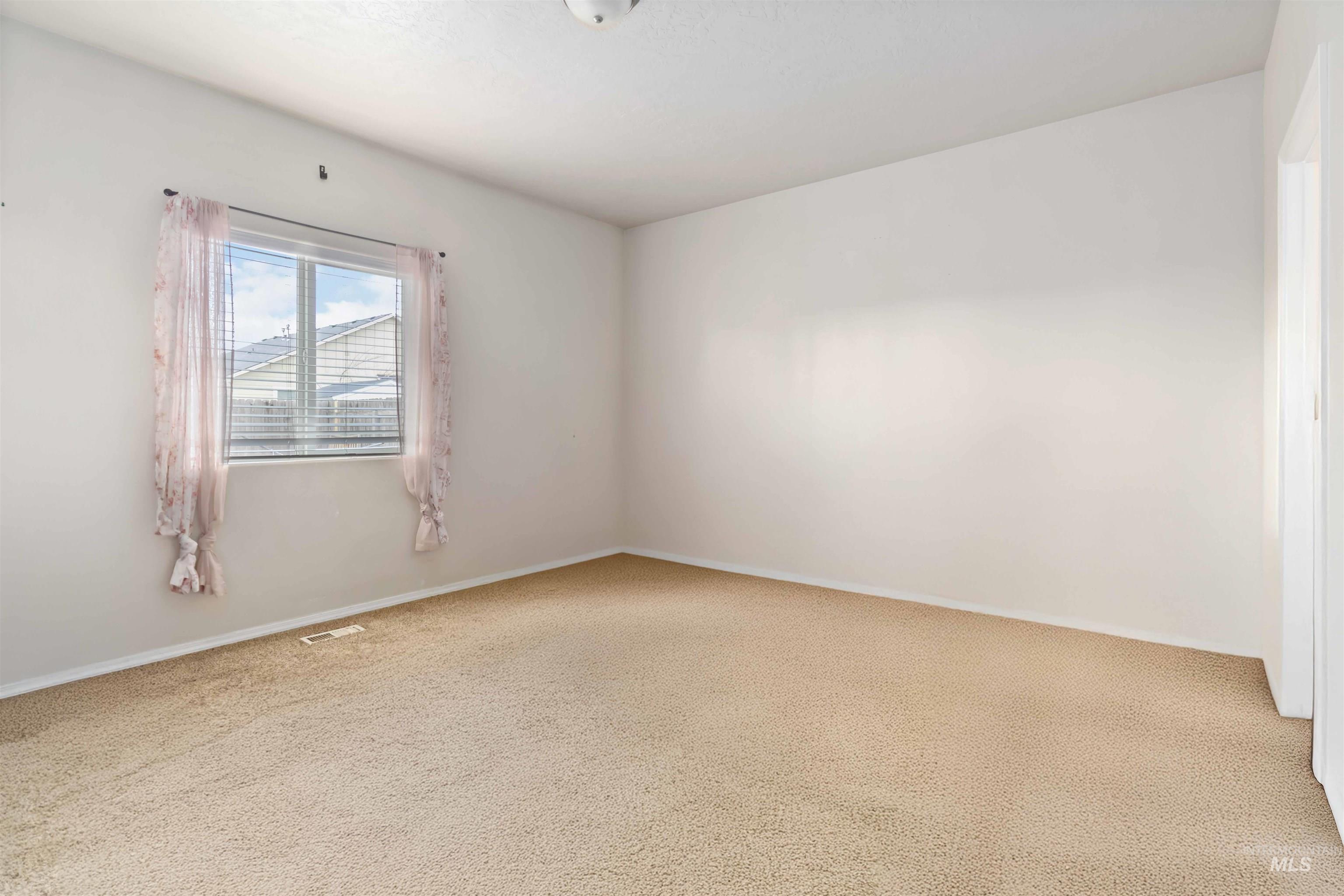 16053 Sunnyfield Avenue Caldwell, ID 83607 - Photo 15 of 35 Unfurnished room with carpet floors and baseboards