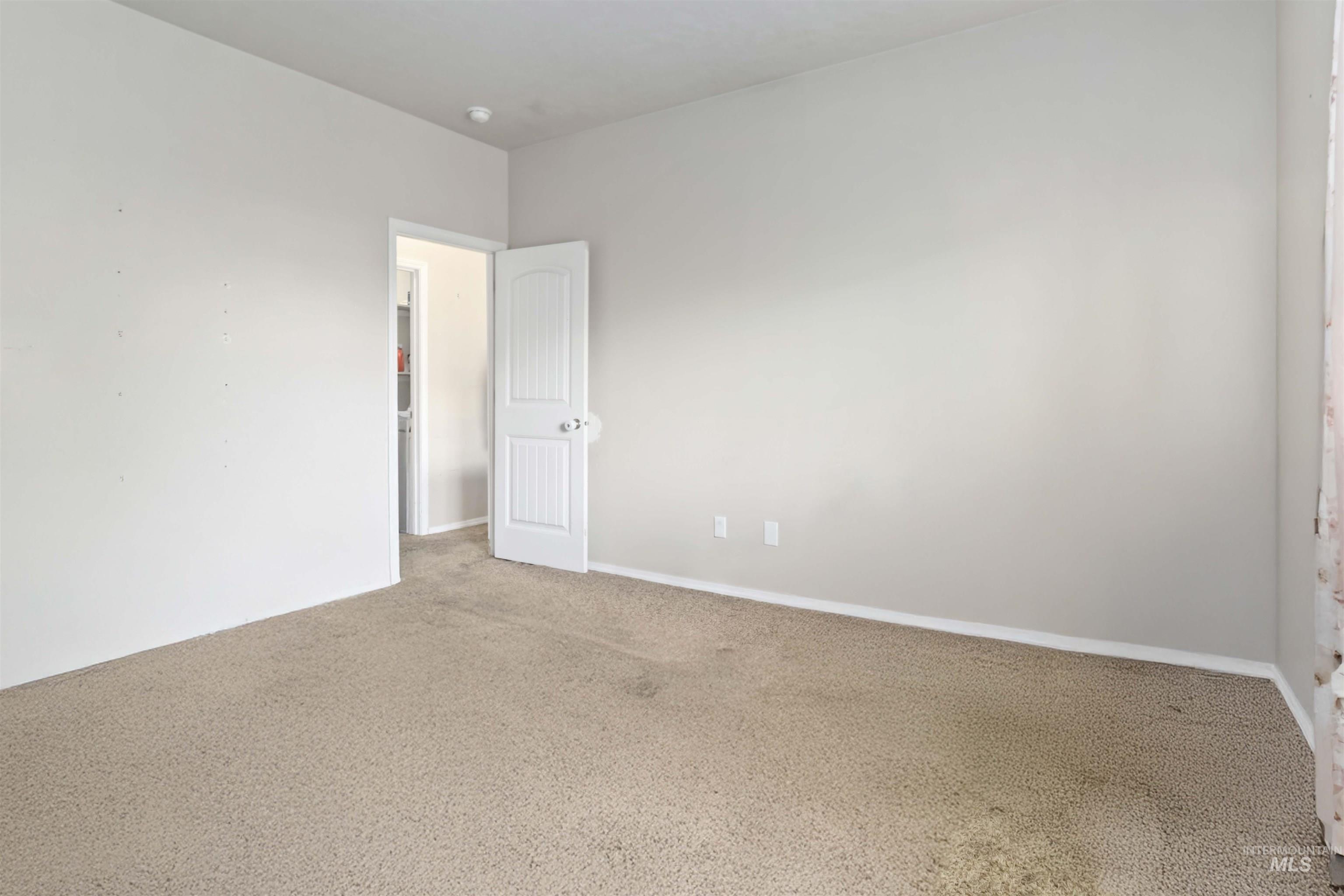 16053 Sunnyfield Avenue Caldwell, ID 83607 - Photo 17 of 35 View of carpeted empty room