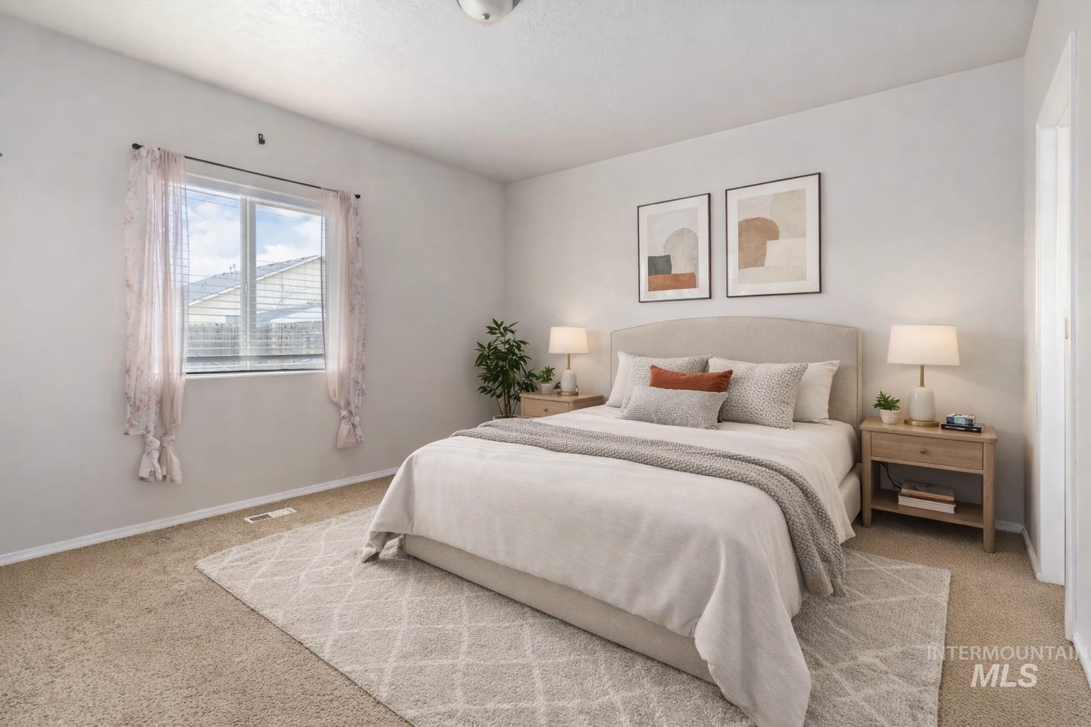 16053 Sunnyfield Avenue Caldwell, ID 83607 - Photo 19 of 35 Bedroom featuring light colored carpet