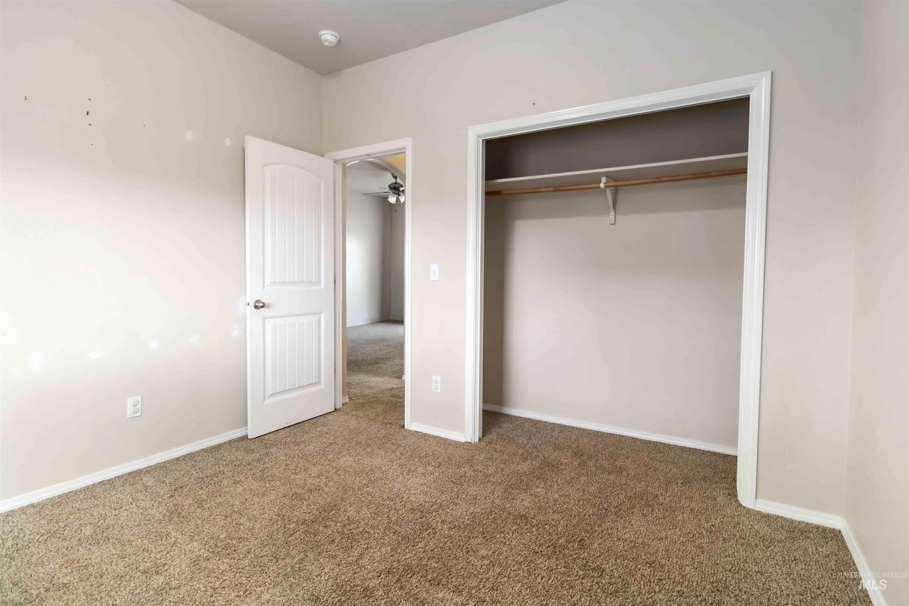 16053 Sunnyfield Avenue Caldwell, ID 83607 - Photo 23 of 35 Unfurnished bedroom with carpet flooring and a closet
