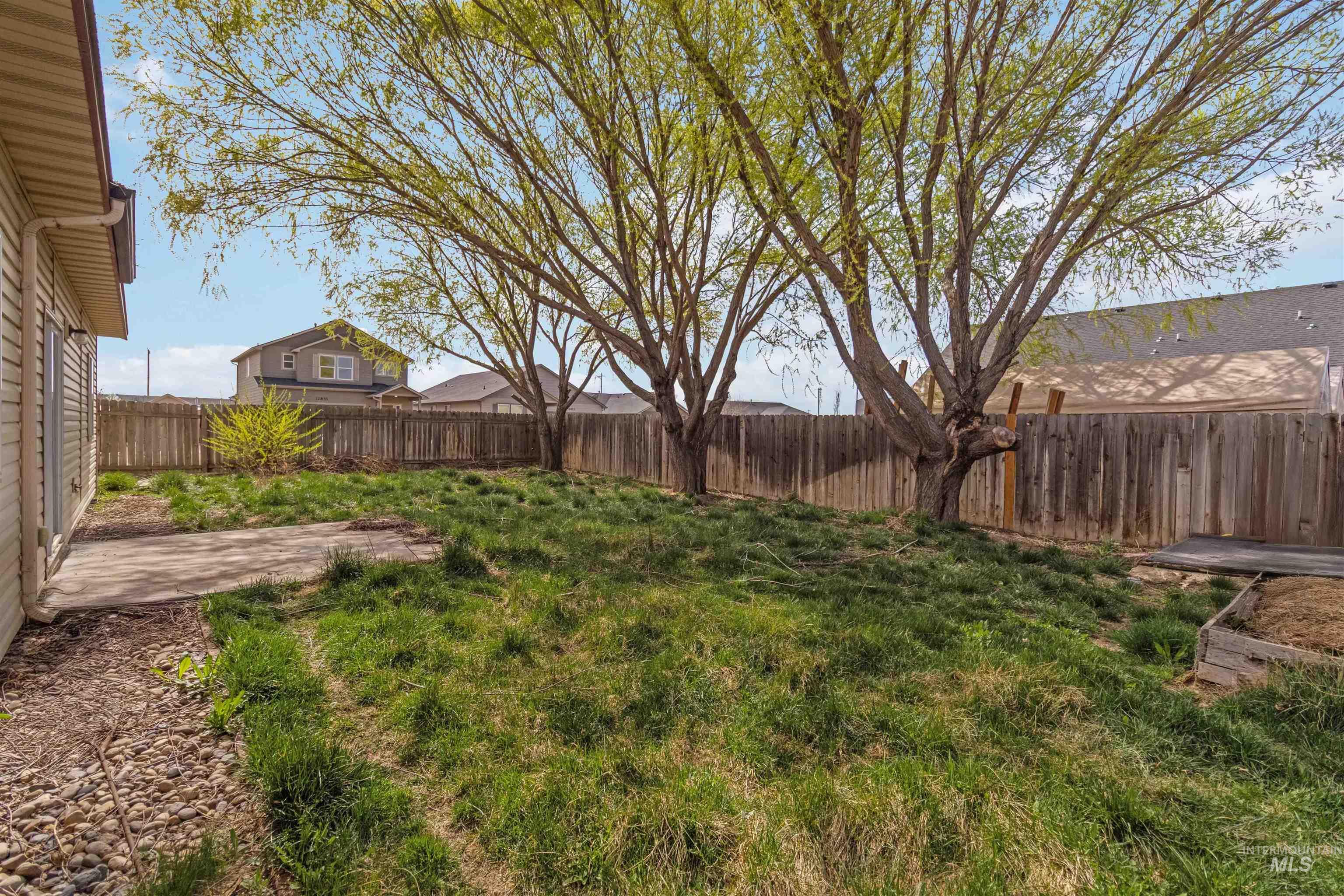 16053 Sunnyfield Avenue Caldwell, ID 83607 - Photo 29 of 35 Fenced backyard with a patio