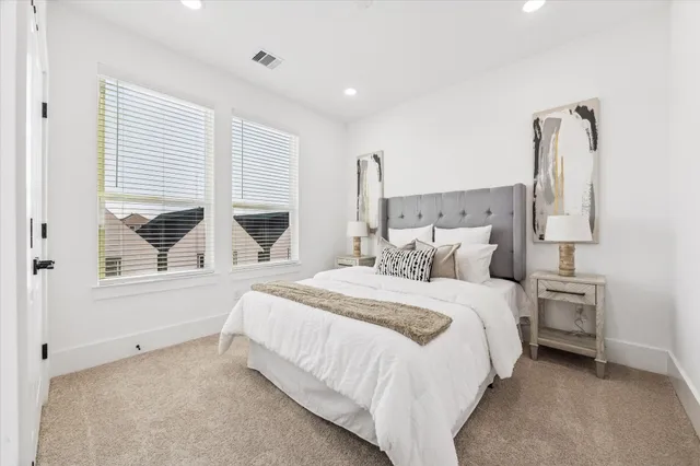 a bedroom with bed and a window