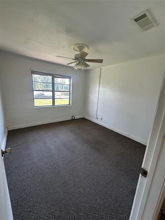 2741 Mill Street Ringgold, LA 71068 - Photo 23 of 30 an empty room with windows and fan