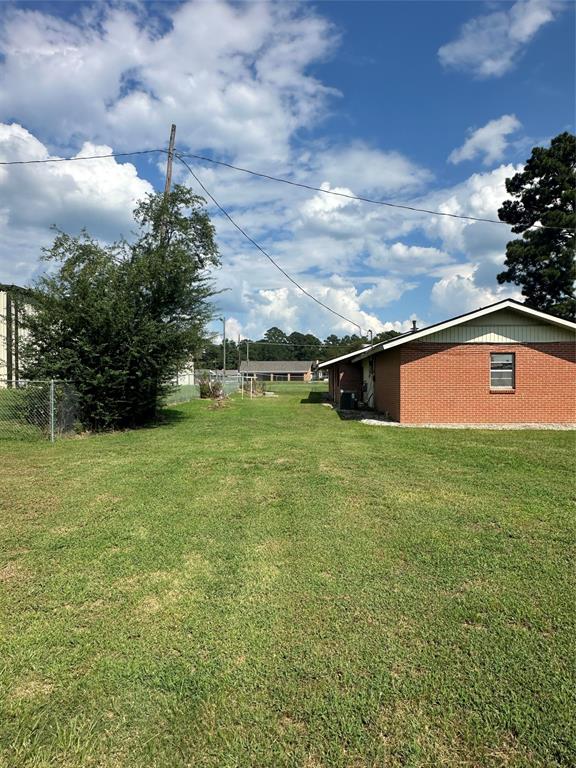 2741 Mill Street Ringgold, LA 71068 - Photo 4 of 30 a view of a big yard with swimming pool and green space