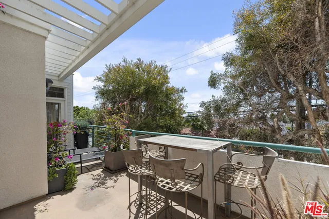 a view of balcony with furniture