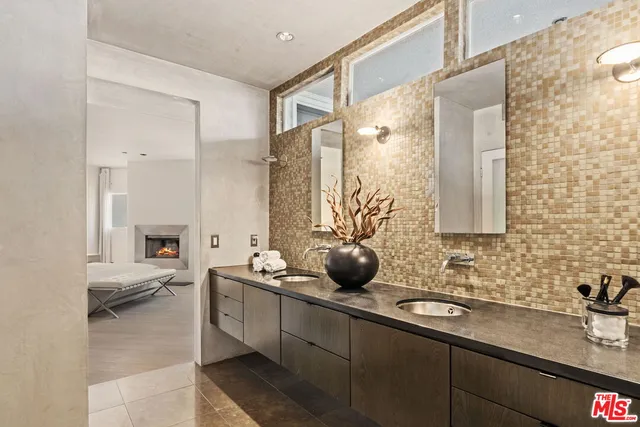 a bathroom with a sink double vanity and a mirror