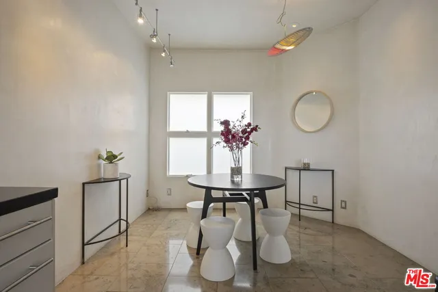 a room with furniture and a potted plant