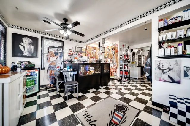 a kitchen with a stove and a refrigerator