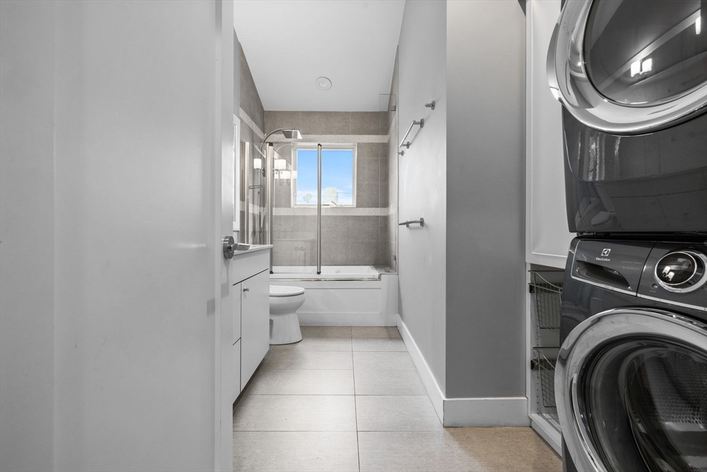 202 Rawson Road, Unit 3 Brookline, MA 02445 - Photo 11 of 17 a bathroom with a sink a mirror and a toilet