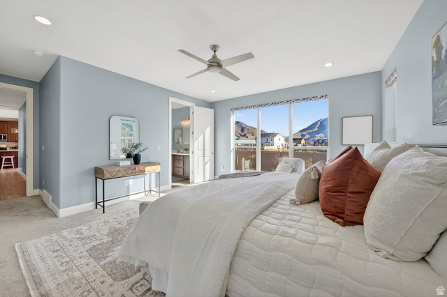1222 West 190th Street North Mapleton, UT 84664 - Photo 25 of 46 Spacious room featuring floor-to-ceiling windows with mountain scenery, a ceiling fan, recessed lighting, and soft carpet flooring