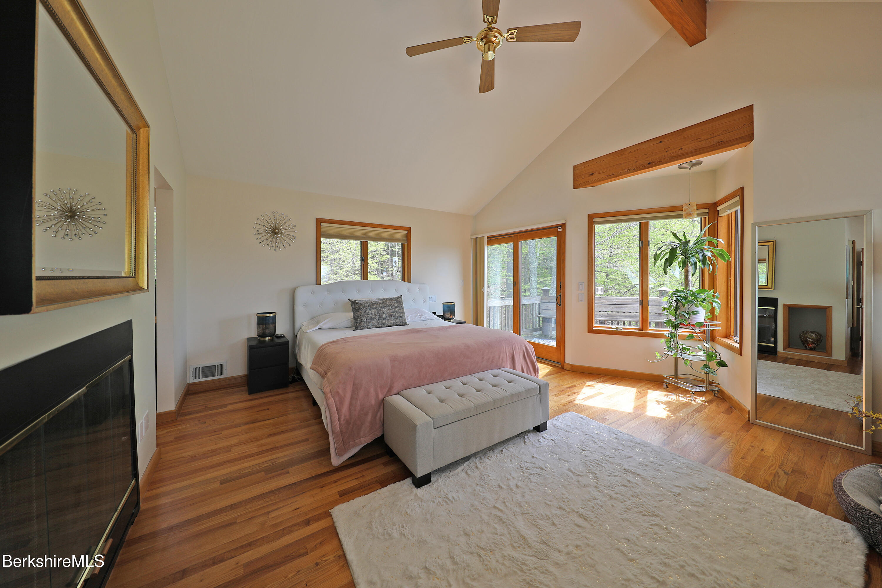126 Temple Road New Lebanon, NY 12125 - Photo 4 of 37 a spacious bedroom with a large bed and a fireplace