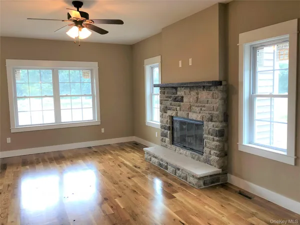 a living room with fireplace and a fireplace