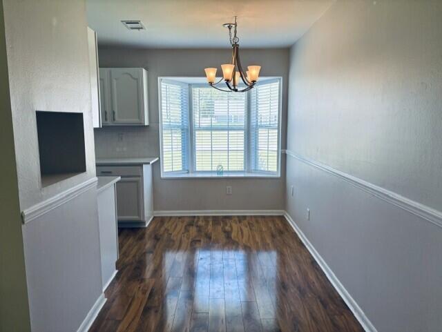 402 Juniper Street Destin, FL 32541 - Photo 7 of 20 a view of an empty room with wooden floor and a window